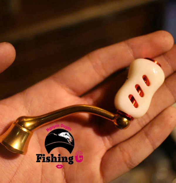 Tay quay vàng  độ máy câu FREAMS , EXCELER ( đời cũ )  núm mạt chược , núm nựa ABS